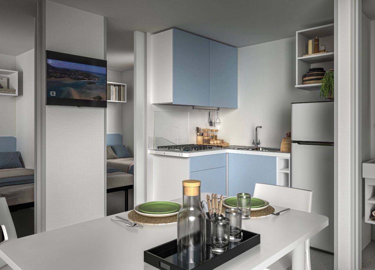 Mobilhome — cucina attrezzata con TV